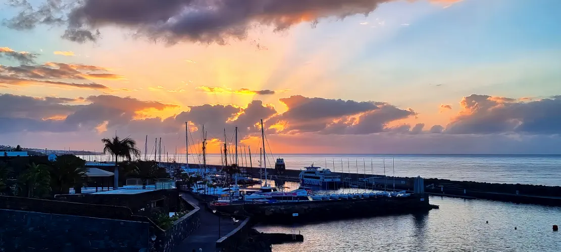 Spain, Lanzarote, Puerto Calero, Sunrise over harbour